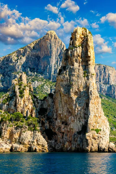 The monolith of Pedra Longa, Baunei, province of Ogliastra, East Sardinia, Italy. The rocky spire which rises majestically out of the sea. Holidays in Sardinia, Italy.