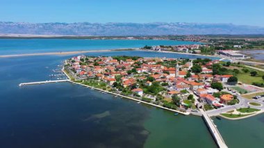 Historic town of Nin laguna aerial view with Velebit mountain background, Dalmatia region of Croatia. Aerial view of the famous Nin lagoon and medieval in Croatia