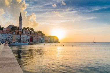 Beautiful sunset at Rovinj in Adriatic sea clipart