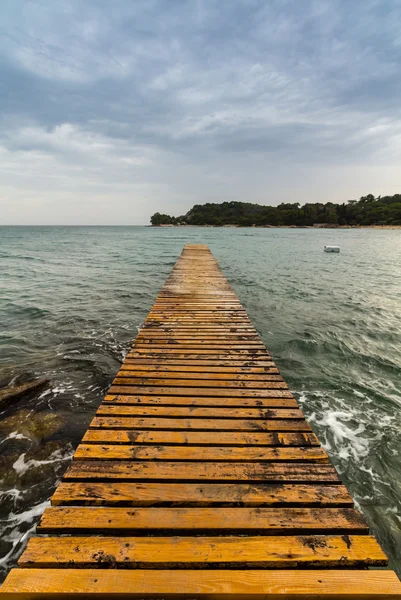 Wood pier on the beach — Stock Photo, Image