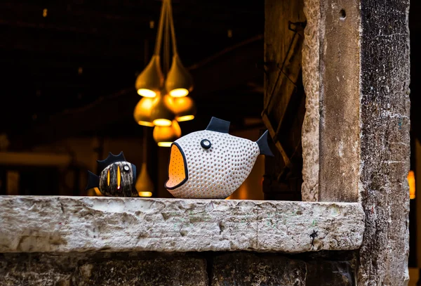 Fish statuette on the narrow streets — Stok fotoğraf