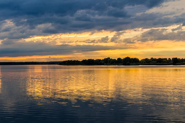 Sunset with dramatic sky over Nove Mlyny lake — Stock Photo, Image