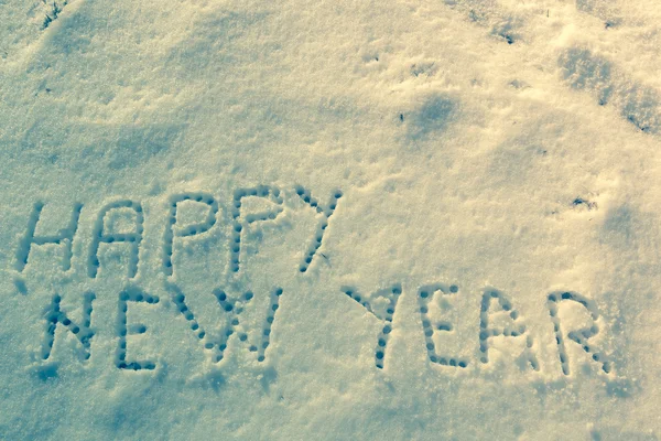 Gelukkig Nieuwjaar bericht op een sneeuwveld — Stockfoto