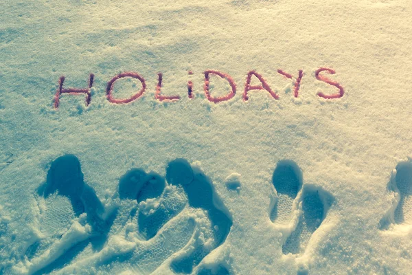 Słowo pisane wakacje na pole śniegu — Zdjęcie stockowe