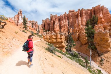 Girl and the views of the hiking trails in Bryce Canyon National Park clipart