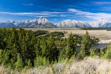 Views of the Grand Teton National Park and the Snake River clipart