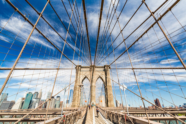 NEW YORK - AUGUST 22: Views of the Brooklyn Bridge on a summer day on August 22, 2015. Its a famous and iconic bridge in New York, which passes the east river.