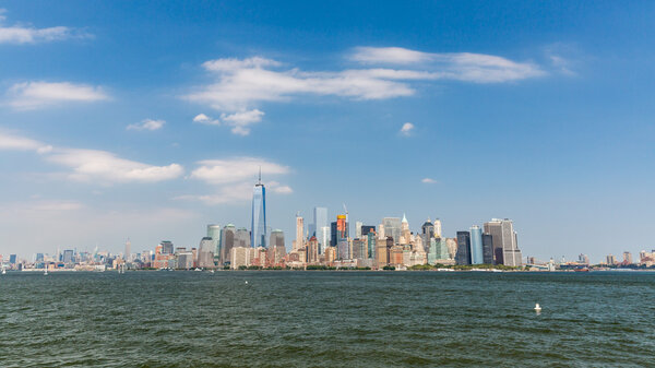 NEW YORK - AUGUST 24: Views of Midtown Manhattan from Liberty Island side on August 24, 2015. This park provides a beautiful view to the Manhattan skyline.