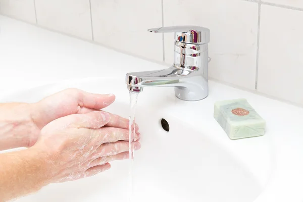 Man washing hands with soap — Stock Photo, Image