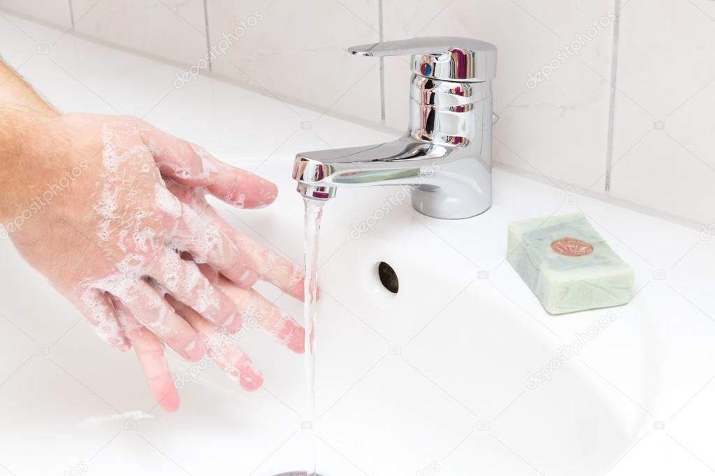 Man washing hands with soap