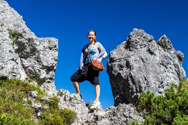 Girl standing between two rocks, Berchtesgaden — Stock Photo, Image