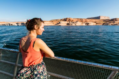 Girl on the boat in the Glen Canyon on the Lake Powell clipart