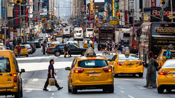 NEW YORK - AUGUST 22: Views of the rush streets of Manhattan at 7th Avenue on August 22, 2015. Its on the intersection of W53 Street near the Times Square.