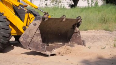 Sarı buldozer satır kum kova