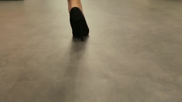Girl walking in black shoes down view — Stock Video