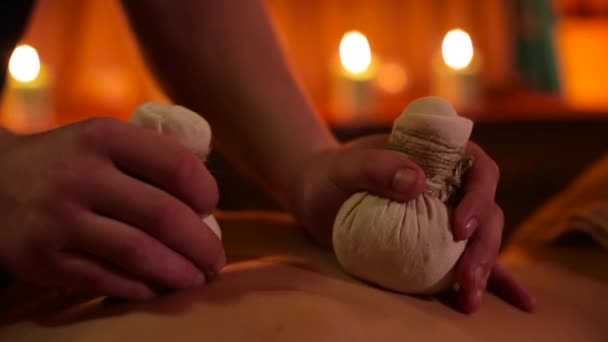Herbal bags massage in spa salon — Stock Video