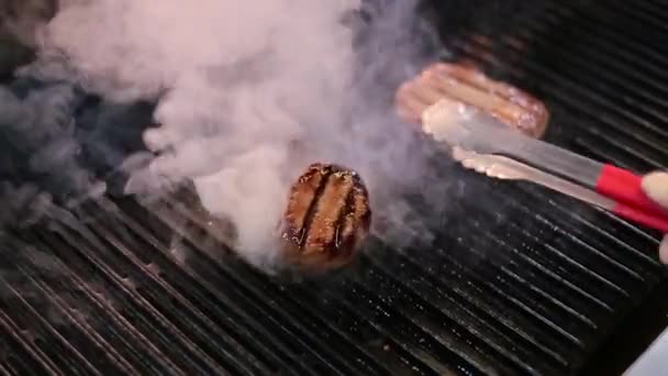 Cook frying the meat on the grill — Stock Video