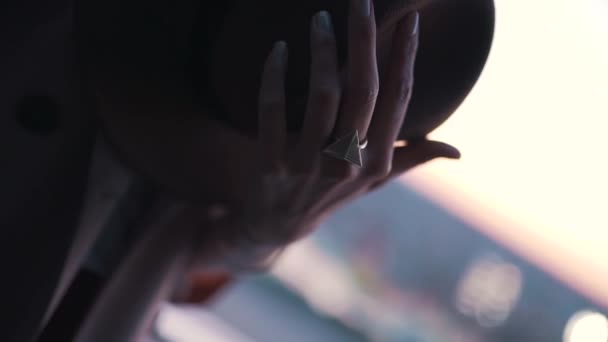 Girl holding a hat in her hands close-up — Stock Video