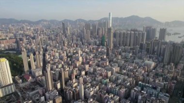 High-Angle Aerial View of an Extremely Dense Urban Sprawl and Mountains