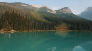 Turquoise Mountain Lake Surrounded by Pine Forests