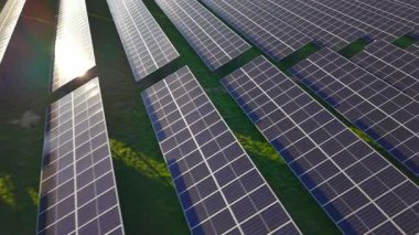 Aerial View of Solar Panels Array on a Green Field