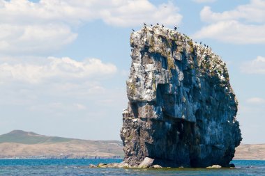 Big rock standing in the sea