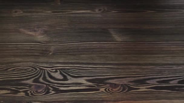 Paaseieren op houten ondergrond — Stockvideo