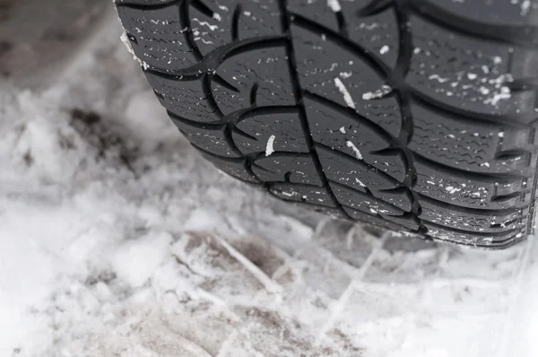 Closeup of Winter tyre on the road — Stock Photo, Image