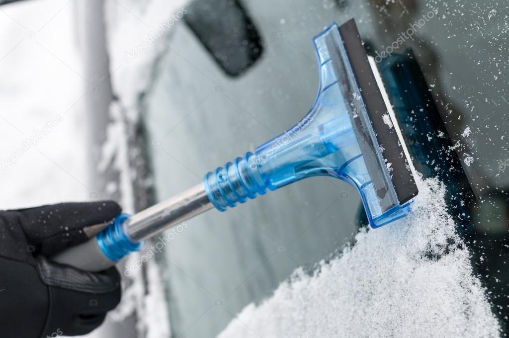 Closeup of Cleaning Car From Snow