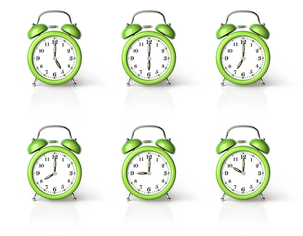 Reloj despertador verde sonando Imagen de archivo