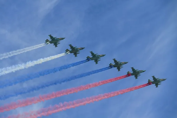 MOSCOW, RUSSIA - MAY 9, 2015: A group of aircraft in-flight smoke color Russian flag. Parade dedicated to May 9, 70-th Victory Day in World War II, Moscow, Russia