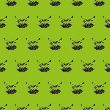 Şirin kedinin baş seamless modeli yeşil bir arka plan üzerinde