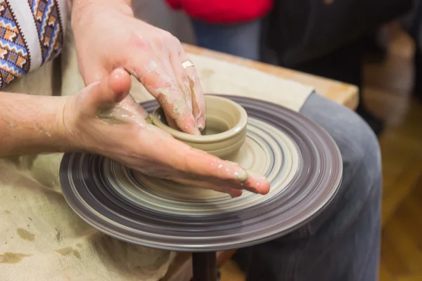 Hands working on pottery wheel — Stock Photo, Image
