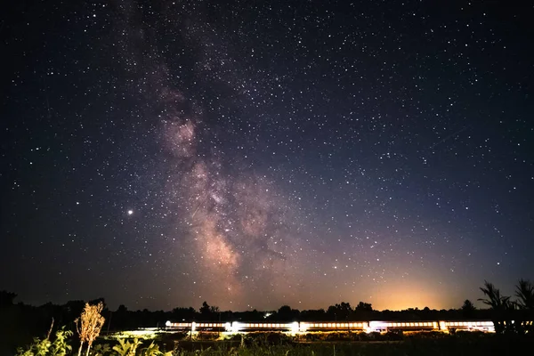 Milky Way Over Express Train at night sky.