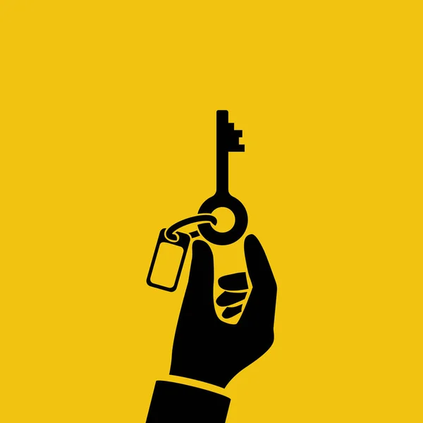 Black silhouette hand holding key with a blank key fob. — Image vectorielle