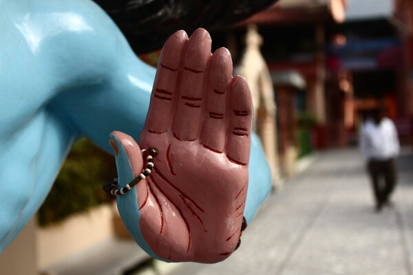 Hand of dancing Shiva statue in the Parmarth Niketan Ashram. Rishikesh, North India.
