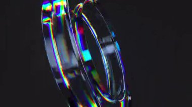 3D cam yayılma efektli şeffaf bir tüp. Parlak renkler, siyah arkaplan. 4k kusursuz döngülü animasyon.