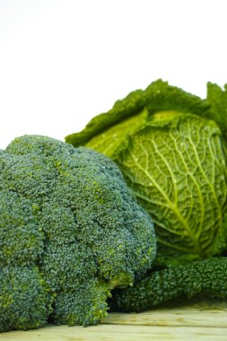 Fresh organic green vegetables on white background