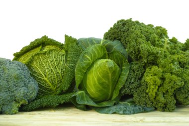Fresh green organic market vegetables on white background clipart