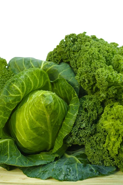 Fresh green organic market vegetables on white background