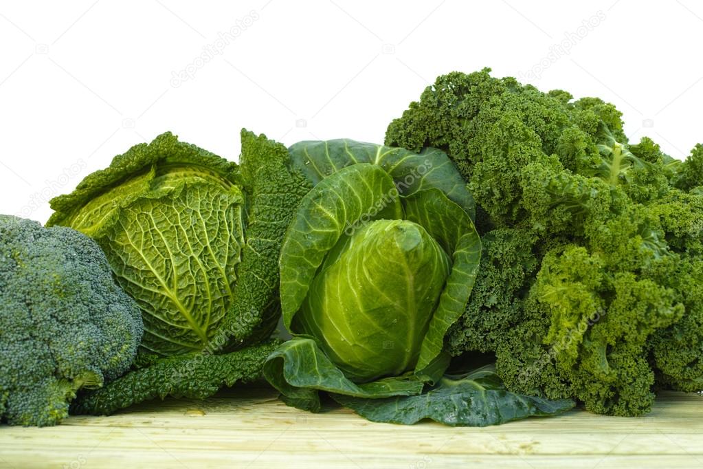 Fresh green organic market vegetables on white background