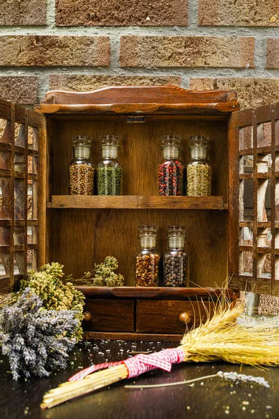 Vintage Wooden Spice Rack Or Storage Cabinet And Six Glass Bottles — Stock Photo, Image