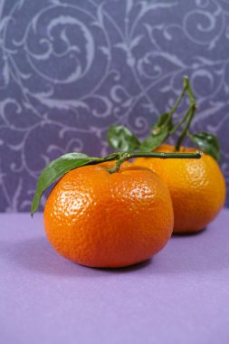 Fresh mandarin oranges fruit with green leaves