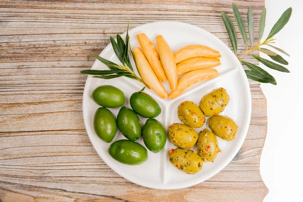 White board with giant  green olives and bread — Stock Photo, Image