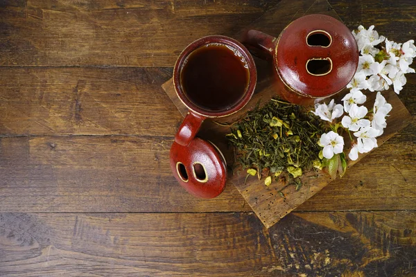 Japan's tea cups with green tea and sakura flowers