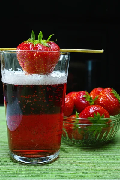 Fresh strawberry drink, radler fruit beer with white foam head