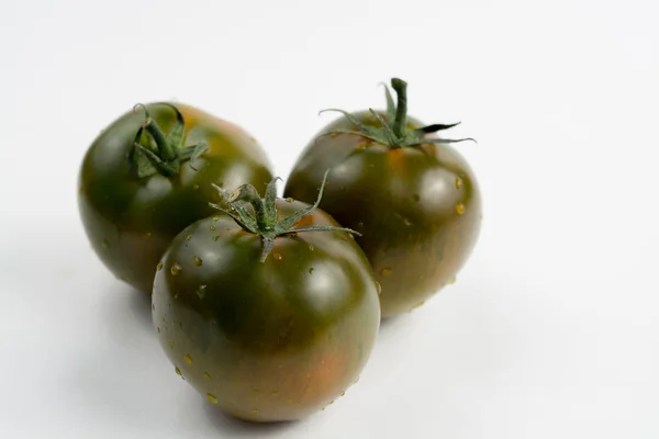 Tomates kumato maduros de color marrón verdoso — Foto de Stock