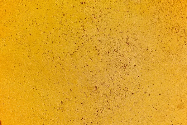 Giallo testurizzato sfondo superficie della parete — Foto Stock