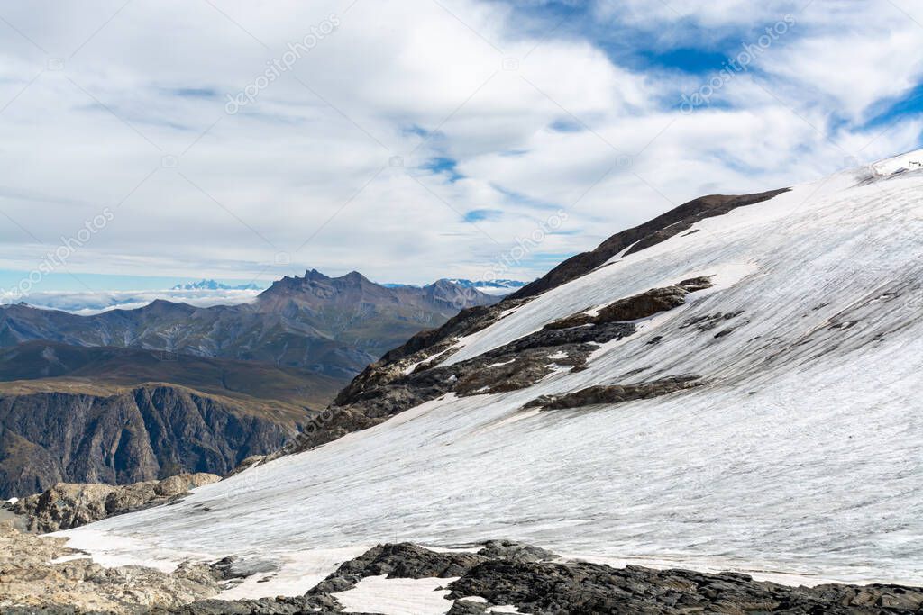 View on icy glacier near winter and summer sky station Les deux Alpes in summer
