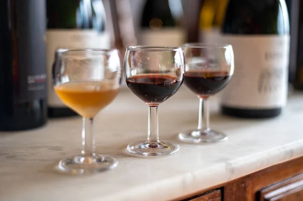 Tasting of Portuguese fortified port wine, produced in Douro Valley, North of Portugal in sunny day